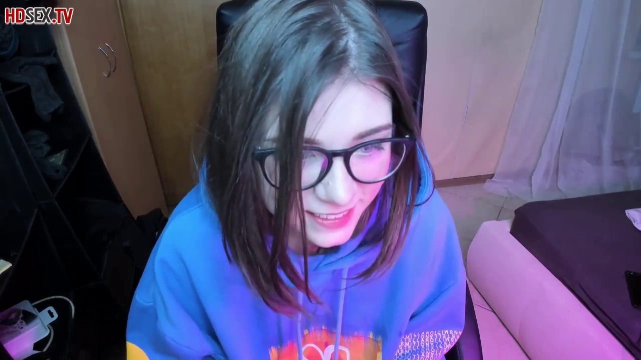 Adorable teen with huge glasses is sucking a new sex toy in front of the web camera